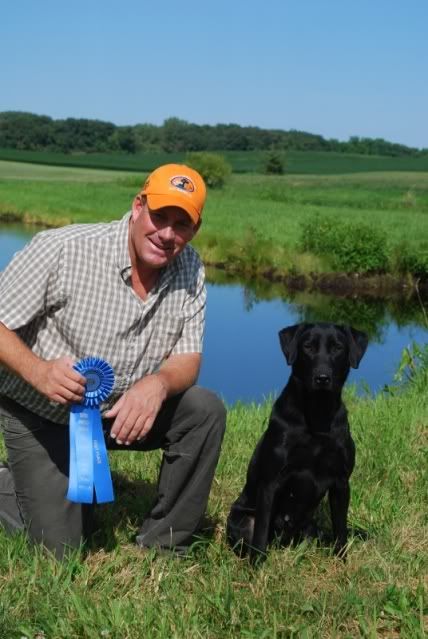Steve and Becky, Becky with her Blue ribbon for winning a 56 dog Qual at CMRC at 25 months old!