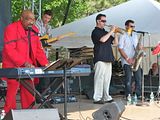 Swamp Dogg standing with band