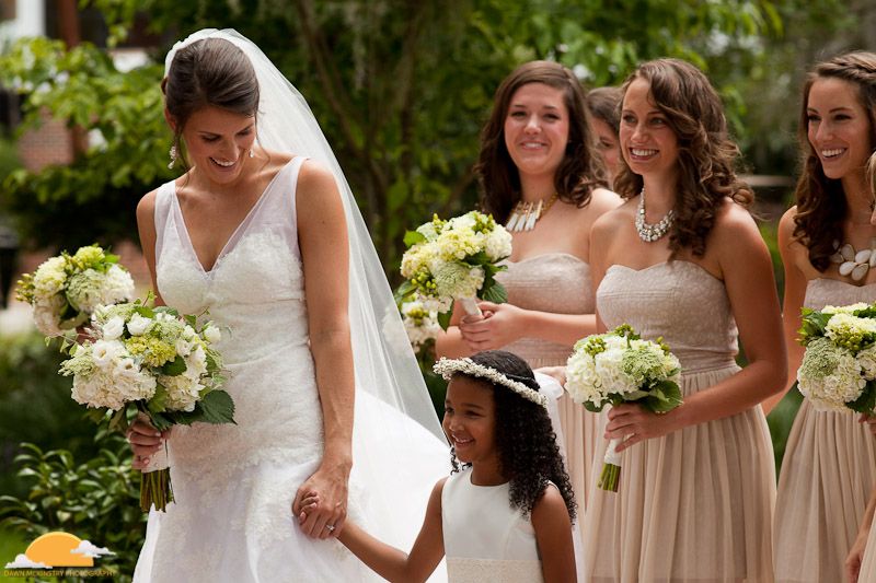 bride with flower girl and bridesmaids bride and bridesmaids in garden