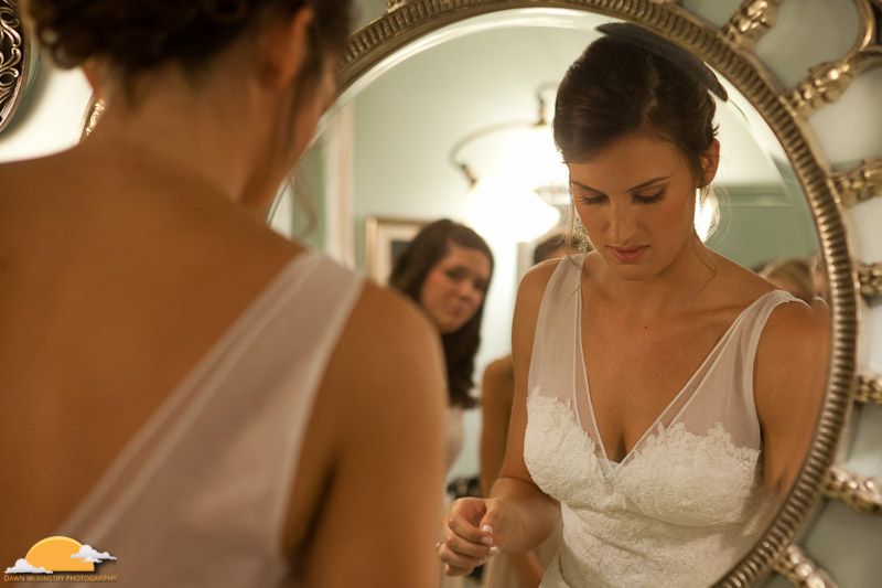 bride looking in mirror bride's reflection in mirror