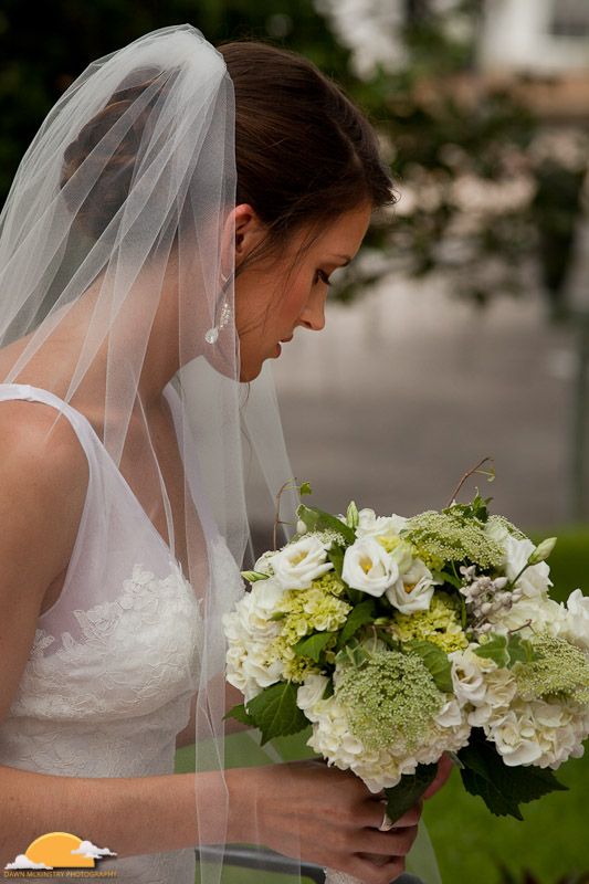 bride with green and white bouquet bride with veil and green and white bouquet