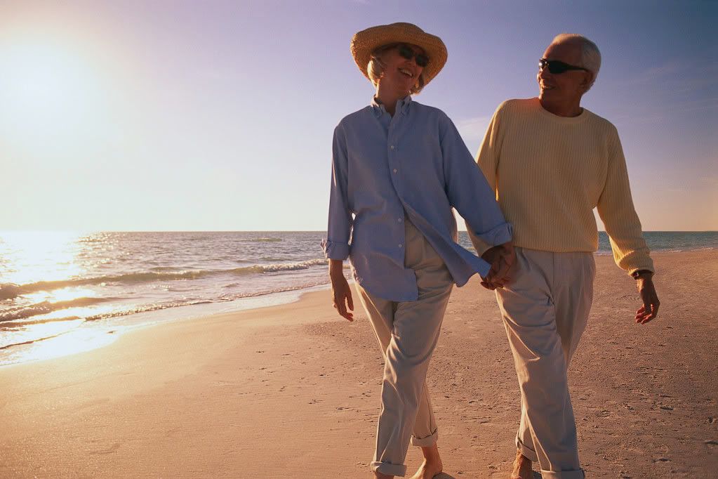 retired couple on beach